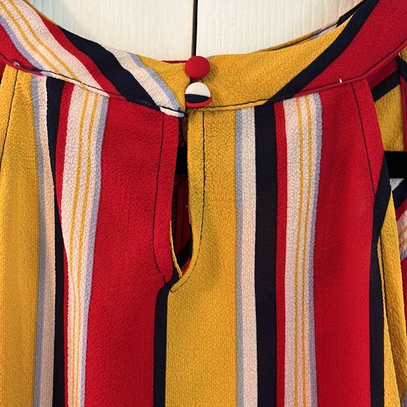 Red, yellow, navy blue tank top with tie bottom and cute button feature on neck. - Picture 2 of 3
